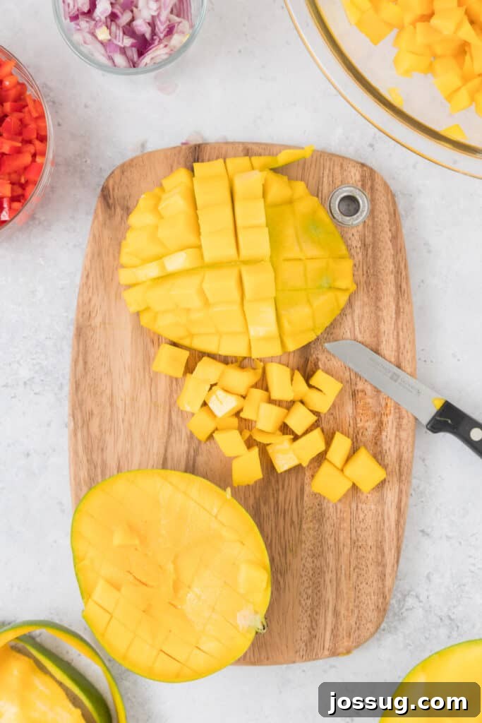 Mango Salsa Delight 4 Fresh mango halves sliced on a cutting board