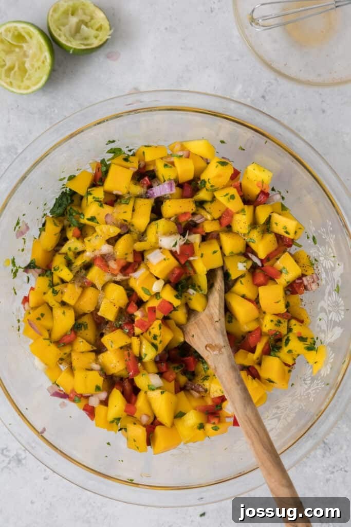 Mango Salsa Delight 10 Mixed mango salsa with lime halves and seasoning bowls nearby