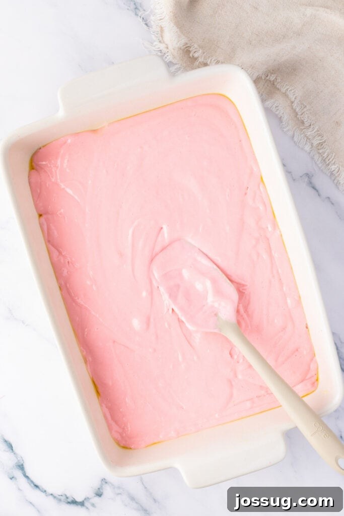 unbaked cake batter in a rectangle baking dish ready to be baked