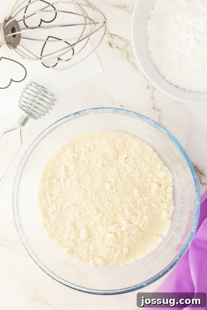 Mixed almond flour and powdered sugar ready for folding into macaron batter.