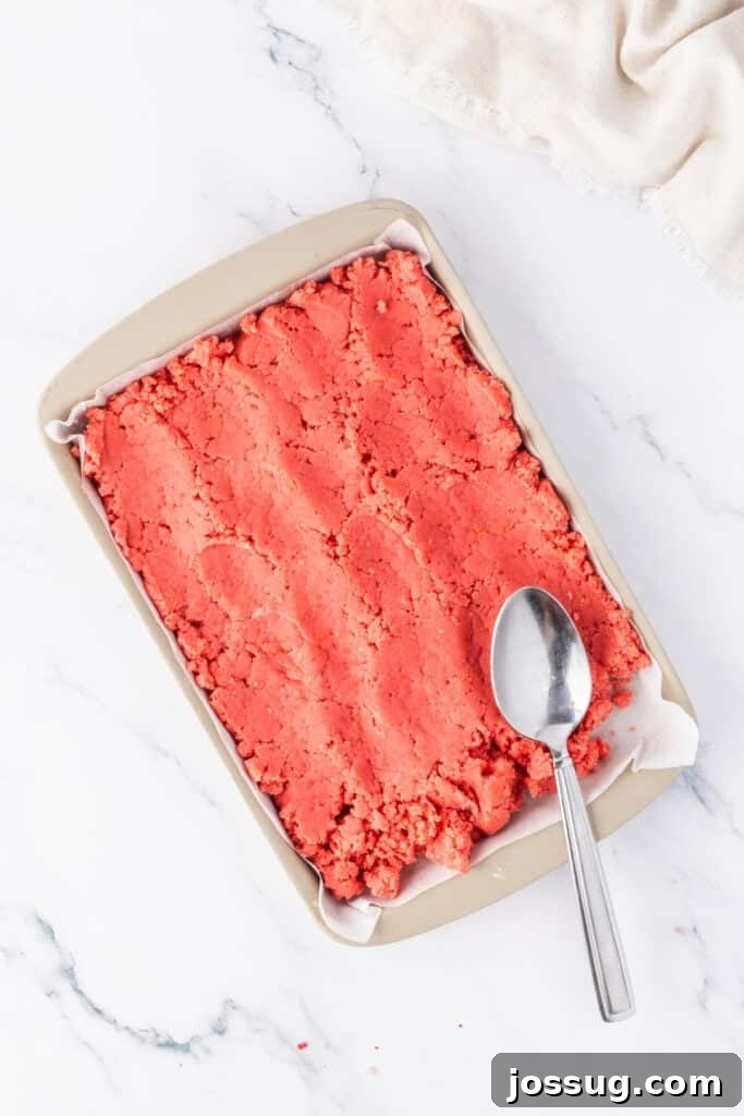 Strawberry Cream Truffle Hearts 9 Strawberry cake mixture pressed into a baking pan before cutting into shapes