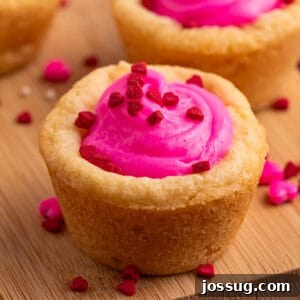 Valentine's Day Sugar Cookie Cups 7 Square image of a Valentine sugar cookie cup with pink frosting and red heart sprinkles