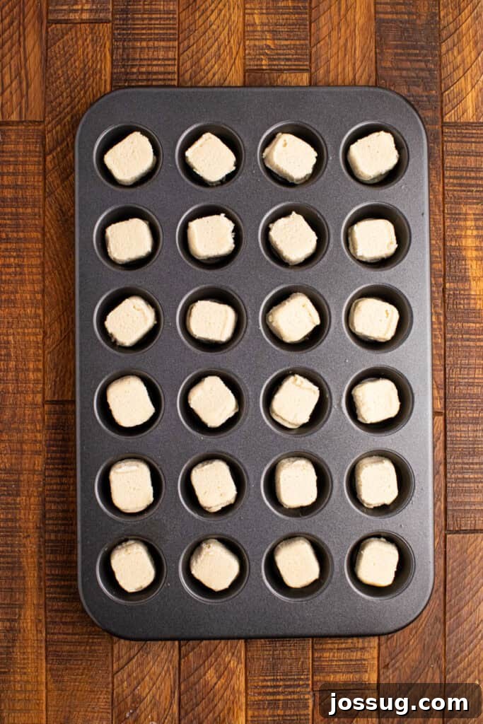 Valentine's Day Sugar Cookie Cups 3 Mini muffin pan filled with unbaked sugar cookie dough pieces ready to be baked into cookie cups
