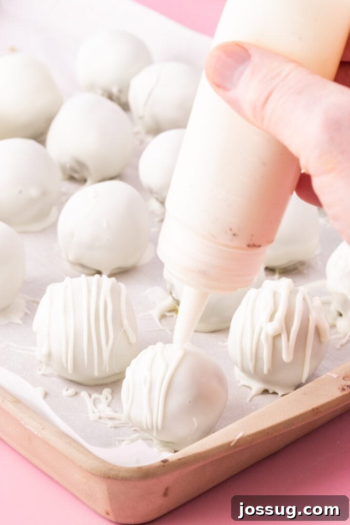 Birthday Cake Bites 10 Drizzling white chocolate over cake truffles before adding sprinkles