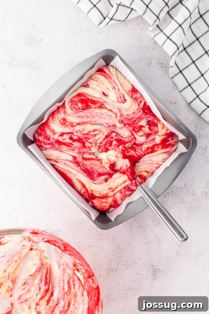 White chocolate raspberry fudge spread in a pan