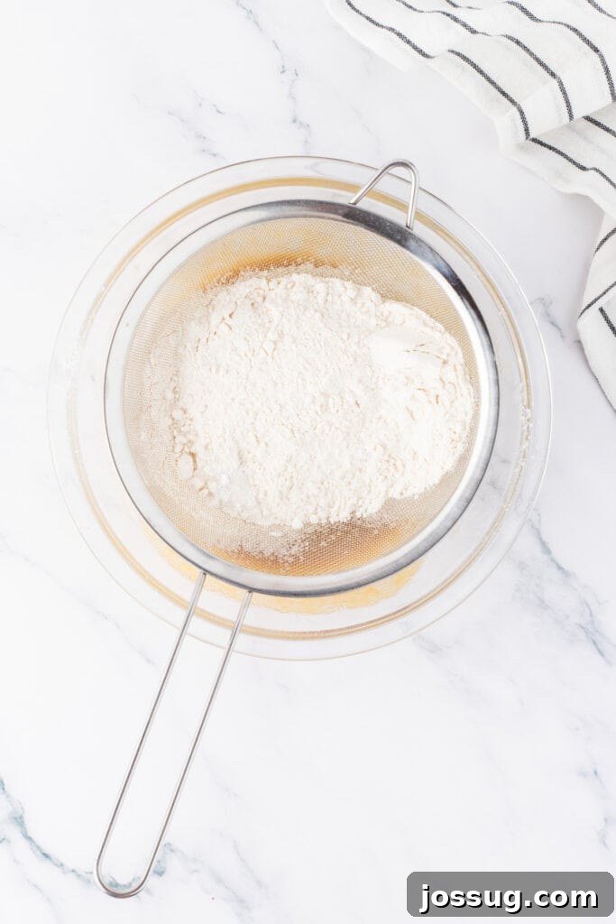White Chocolate Raspberry Bliss Bars 5 Dry ingredients being sifted into batter