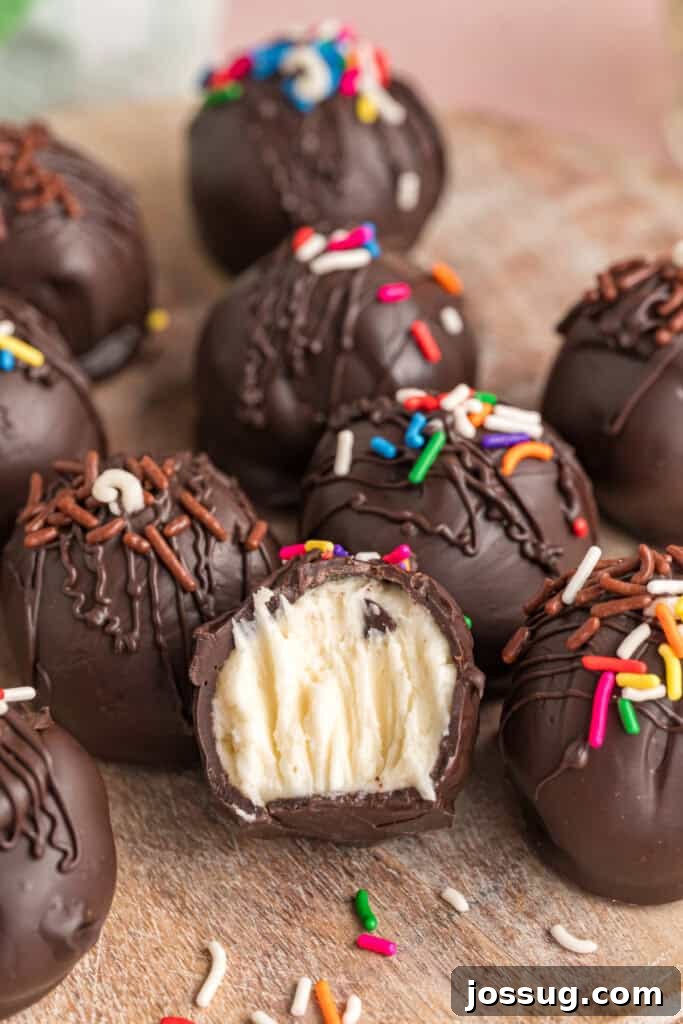 Buttercream Bliss Bites 2 Chocolate coated buttercream truffles with sprinkles arranged on a wooden surface