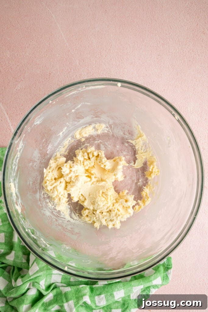 Buttercream Bliss Bites 4 Softened butter mixed with vanilla extract in a glass mixing bowl