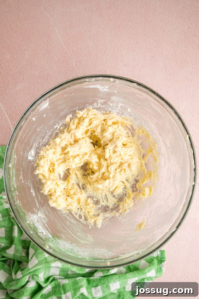 Buttercream Bliss Bites 6 Butter and powdered sugar partially mixed together in a glass bowl