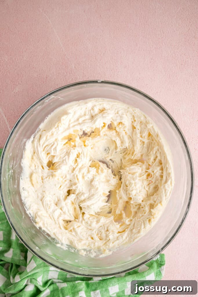 Buttercream Bliss Bites 9 Smooth and fluffy buttercream filling in a glass mixing bowl