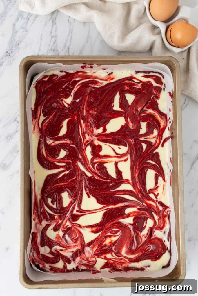 Red velvet and cream cheese swirled together
