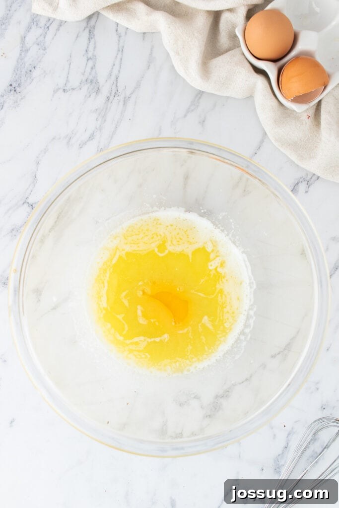 Mixing bowl with melted butter and egg