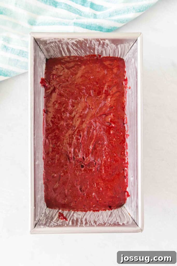 Red Velvet Dream Loaf 5 Red velvet batter spread evenly inside a greased loaf pan