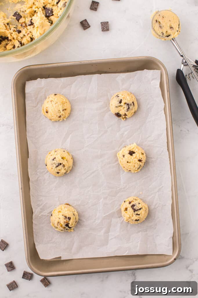 Pistachio Dream Cookies 8 Cookie dough balls on a baking sheet.