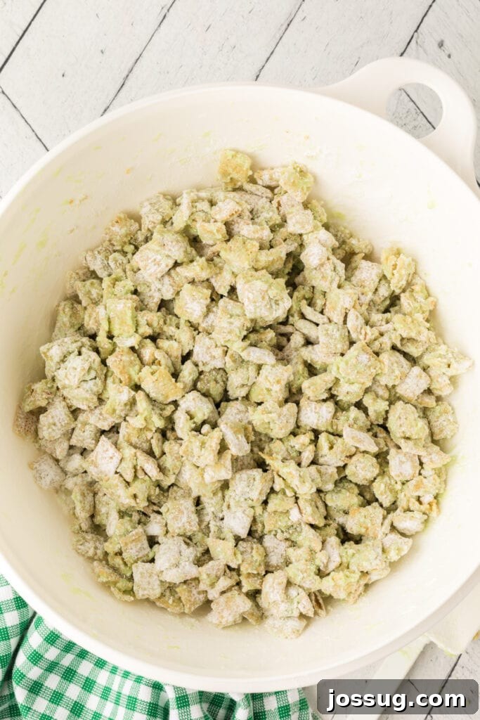 Pistachio Puppy Chow 12 Muddy buddies fully coated in powdered sugar.