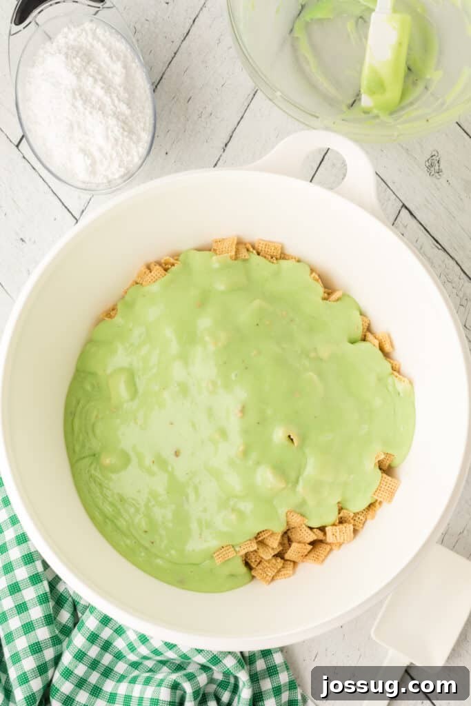 Pistachio Puppy Chow 9 Pouring pistachio mixture over Chex cereal.