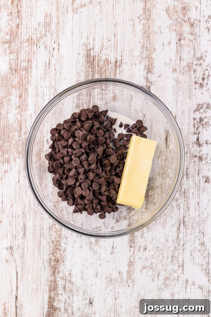 Chocolate chips and butter in a glass bowl