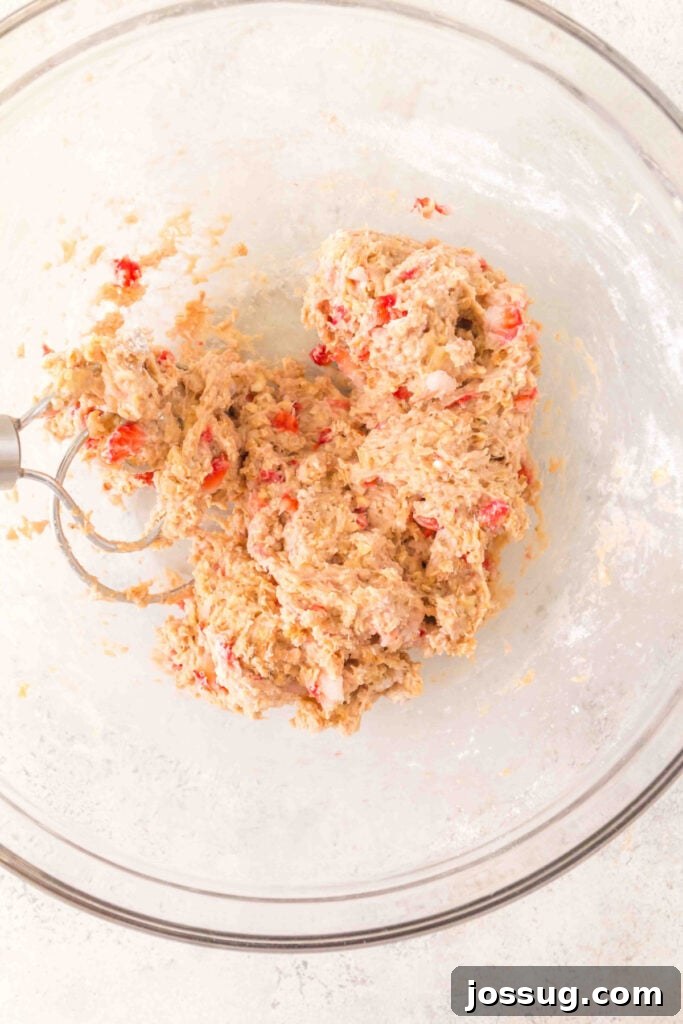 mixed strawberry banana dog treat dough with visible oats and strawberry pieces