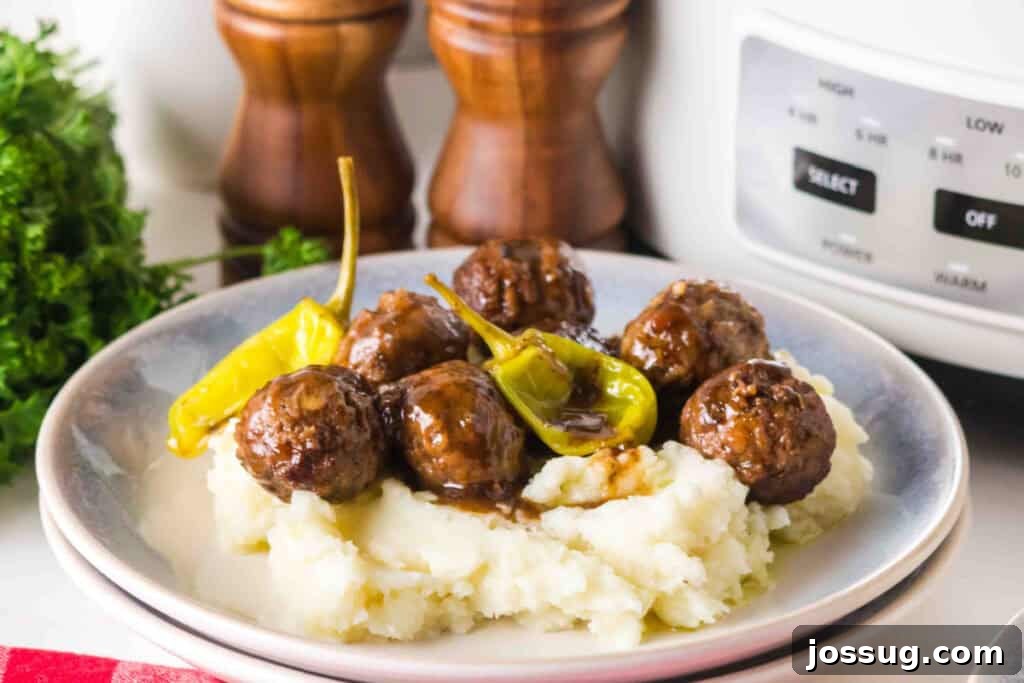 Slow Cooker Mississippi Meatballs Served on Mashed Potatoes