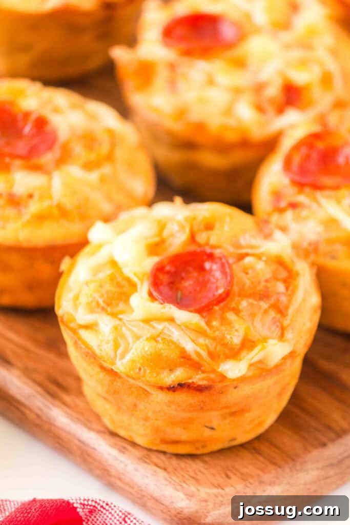 Pizza Muffin Magic: Bite-Sized Delights 2 Delicious Pizza Muffins with melted cheese and pepperoni