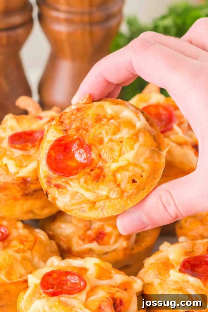 Pizza Muffin Magic: Bite-Sized Delights 5 Close-up of a delicious Pizza Muffin with melted cheese