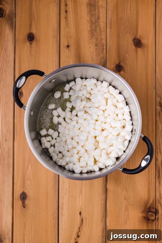 Mini Marshmallows Added to Melted Butter in a Saucepan