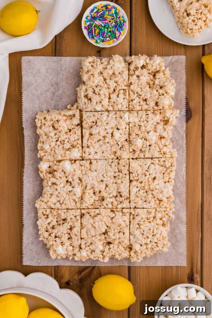 Cut Lemon Rice Crispy Treats Arranged on Parchment Paper
