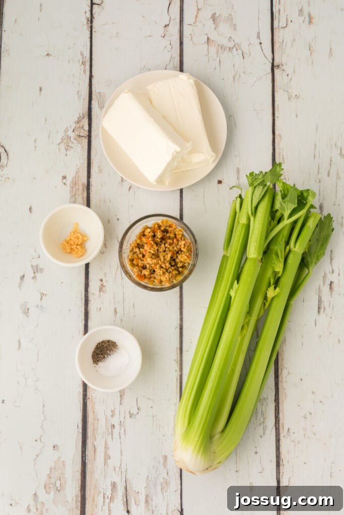 Celery stalks, cream cheese blocks, chopped olives, minced garlic, and salt and pepper in small bowls on a wooden surface