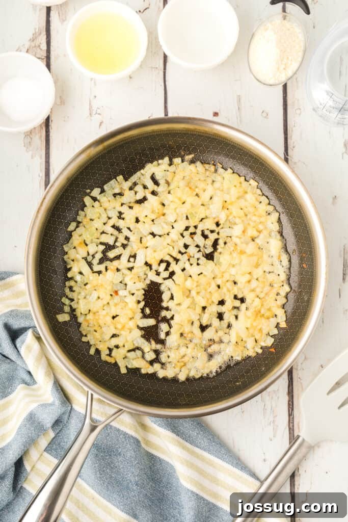 chopped onions cooking in butter in a skillet until softened and lightly golden