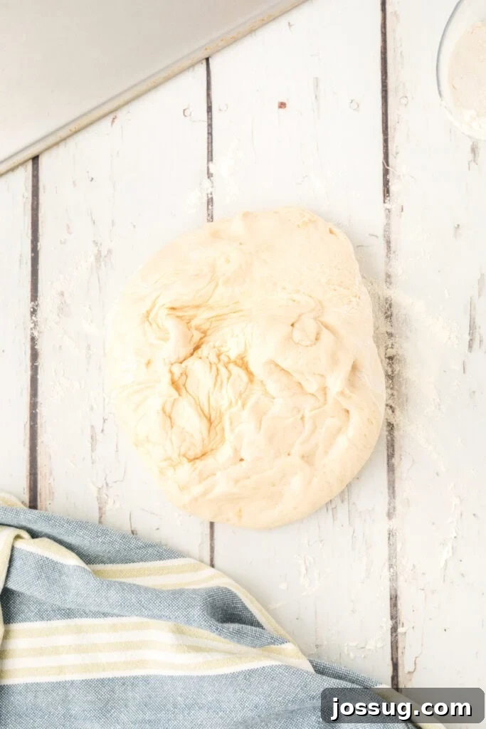 homemade onion rolls dough turned out onto a lightly floured surface
