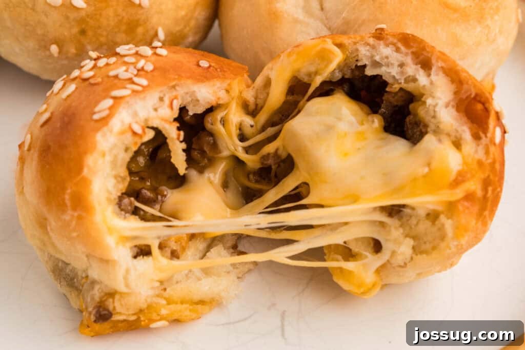 burger bomb pulled apart showing melted cheese stretching between the halves