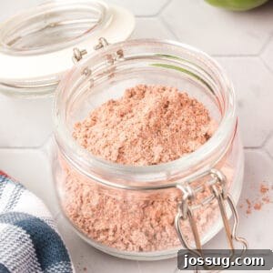 A square image of homemade fajita seasoning in a glass jar, perfect for recipe cards and social media sharing.