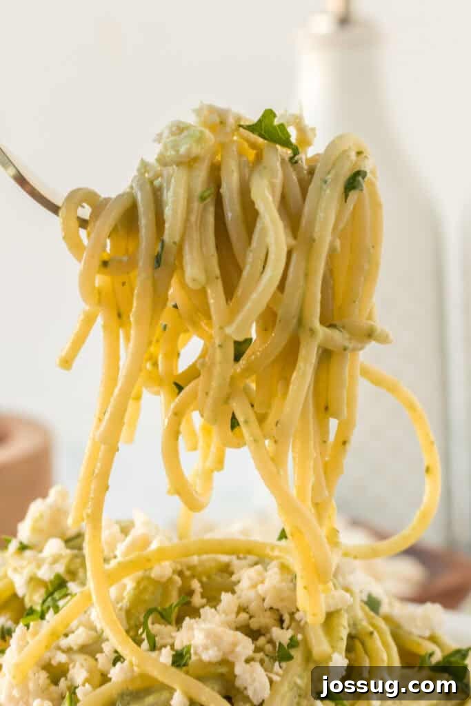 Creamy Mexican Verde Spaghetti (Espagueti Verde) 13 Fork twirling creamy Mexican Green Spaghetti with poblano sauce and queso fresco