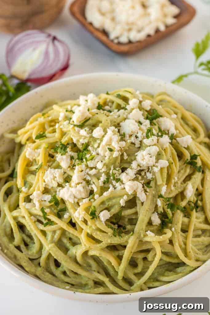 Creamy Mexican Verde Spaghetti (Espagueti Verde) 14 Close-up of creamy Espagueti Verde with queso fresco and fresh cilantro