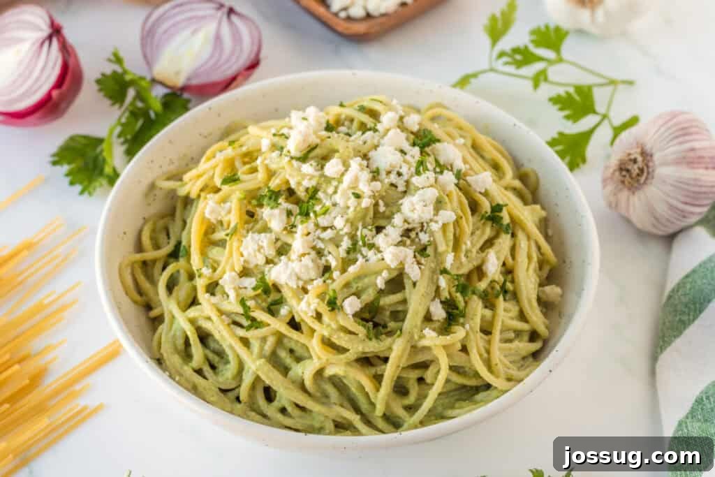 Creamy Mexican Verde Spaghetti (Espagueti Verde) 4 Creamy Espagueti Verde garnished with queso fresco in serving bowl