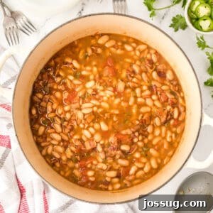 Ranchero Pinto Beans with Bacon — Flavorful Skillet Recipe 15 Ranchero Beans recipe in a Dutch oven with bacon, tomatoes, and pinto beans