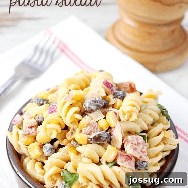 Ranchero Pinto Beans with Bacon — Flavorful Skillet Recipe 17 Creamy Chipotle Pasta Salad in a brown bowl with a fork.