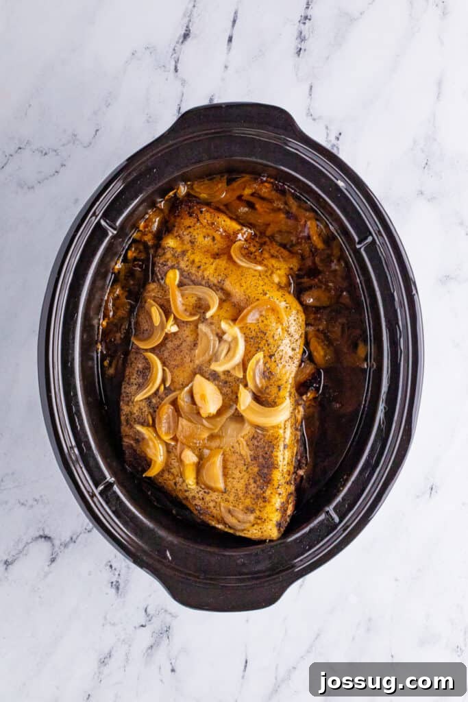 Cooked pork shoulder in slow cooker for Slow Cooker Carnitas