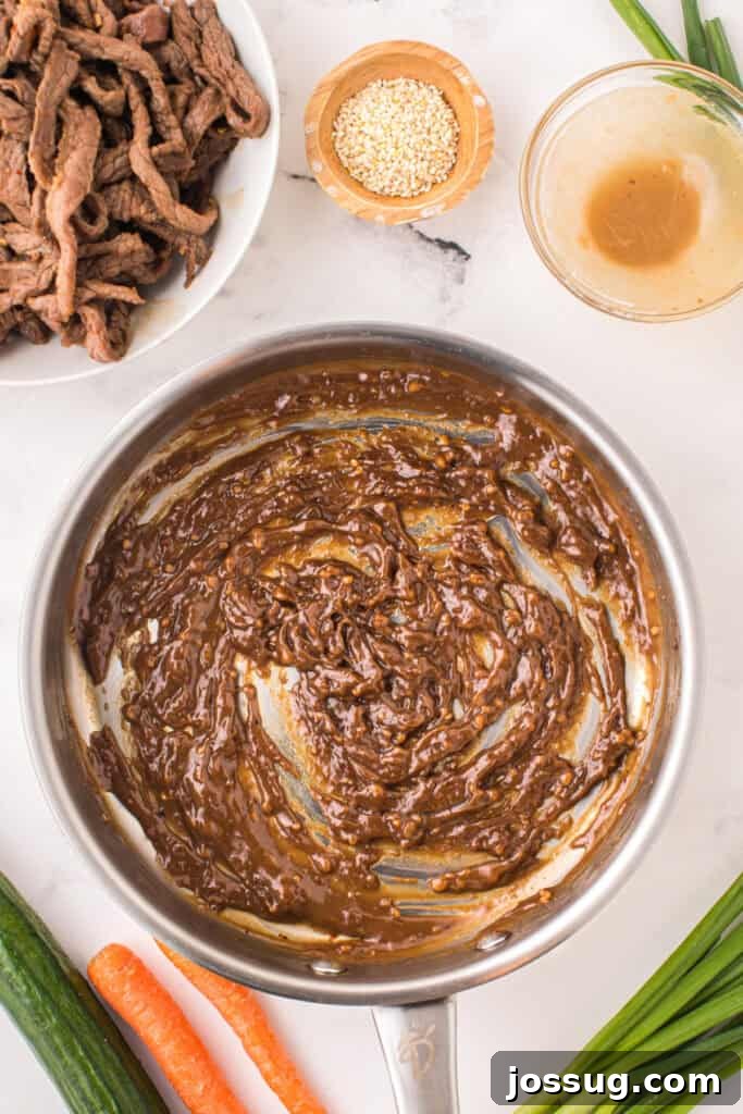 Thickened bulgogi sauce cooking in a skillet for Korean Beef Bulgogi