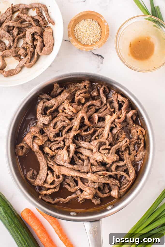 Korean Beef Bulgogi with cooked beef strips and thickened savory bulgogi sauce in a skillet
