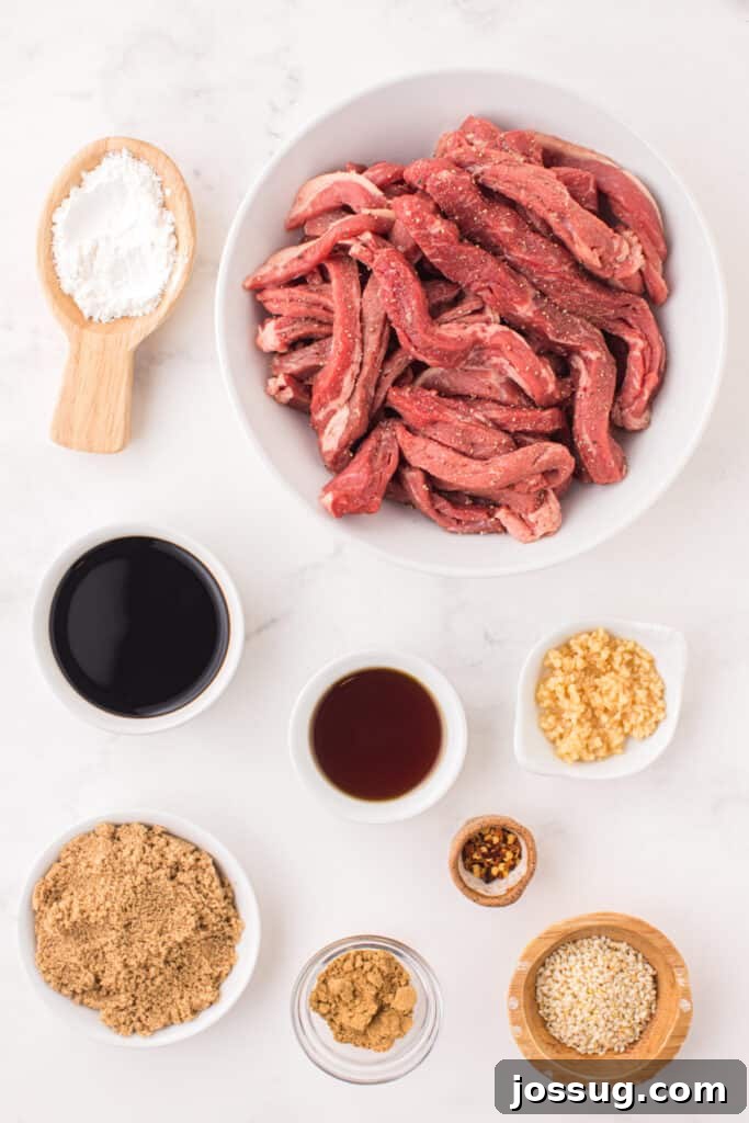 Raw sliced beef strips with soy sauce, sesame oil, brown sugar, garlic, ginger, sesame seeds, and cornstarch for Korean Beef Bulgogi