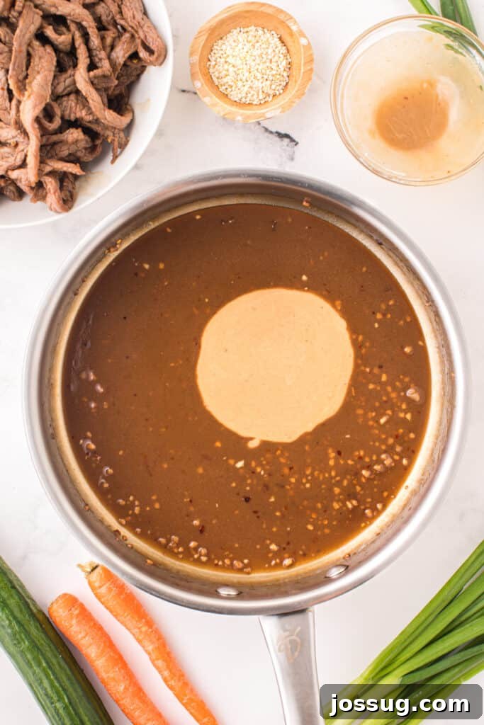 Cornstarch slurry added to bulgogi sauce in a skillet while making Korean Beef Bulgogi