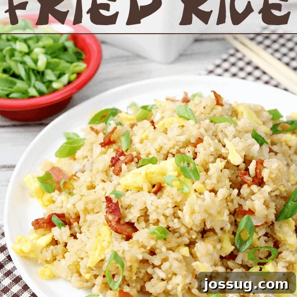 Bacon & Egg Breakfast Fried Rice on a white plate.