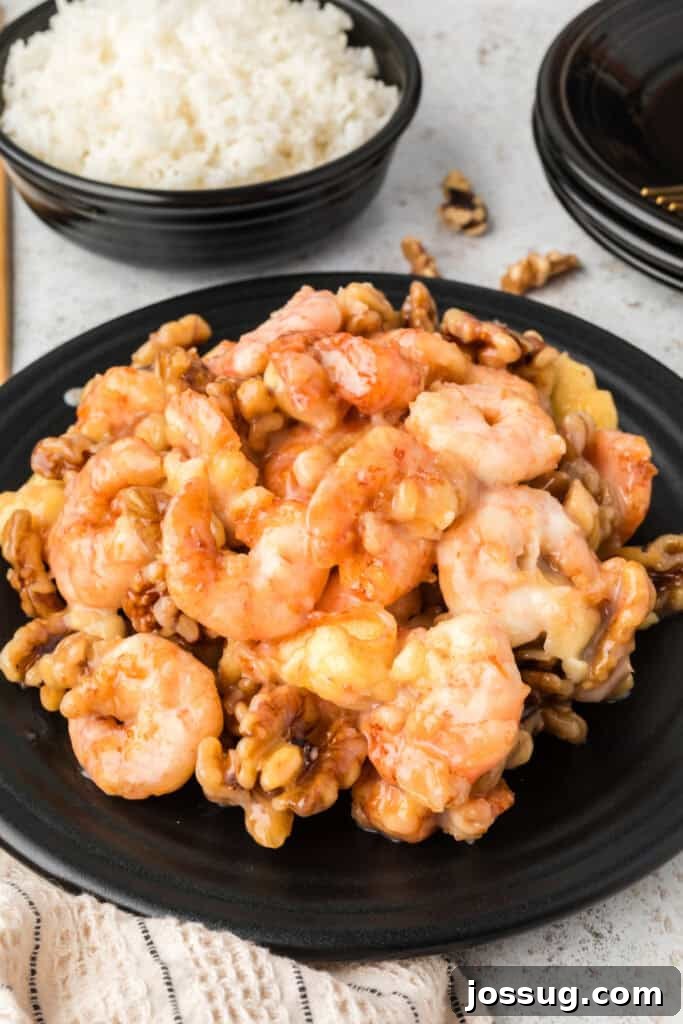 Crispy Honey Walnut Shrimp Recipe: Restaurant-Style at Home 20 Honey Walnut Shrimp served on a black plate with white rice