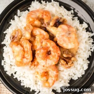Crispy Honey Walnut Shrimp Recipe: Restaurant-Style at Home 23 Honey Walnut Shrimp served over white rice with creamy sauce and candied walnuts