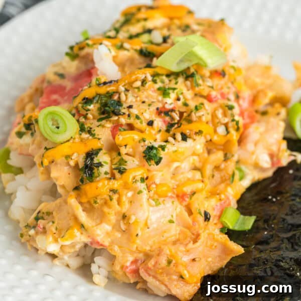Crispy Honey Walnut Shrimp Recipe: Restaurant-Style at Home 27 Close-up square image of sushi bake on a plate with creamy crab filling, furikake, and spicy mayo drizzle.