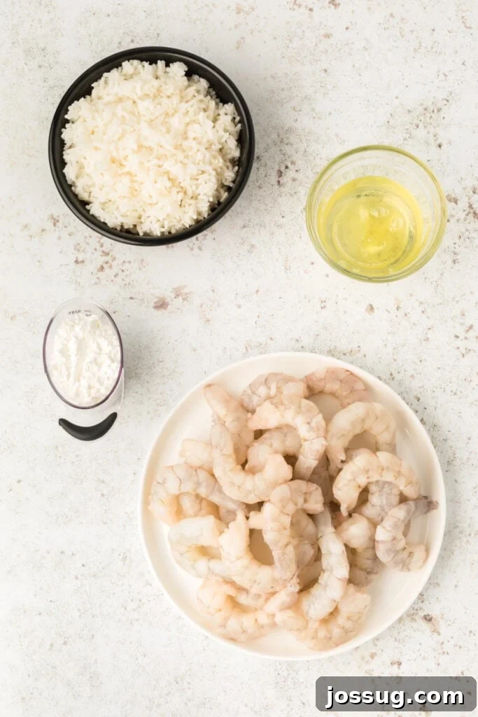 Crispy Honey Walnut Shrimp Recipe: Restaurant-Style at Home 5 Raw shrimp, egg whites, cornstarch, and rice prepared for Honey Walnut Shrimp recipe