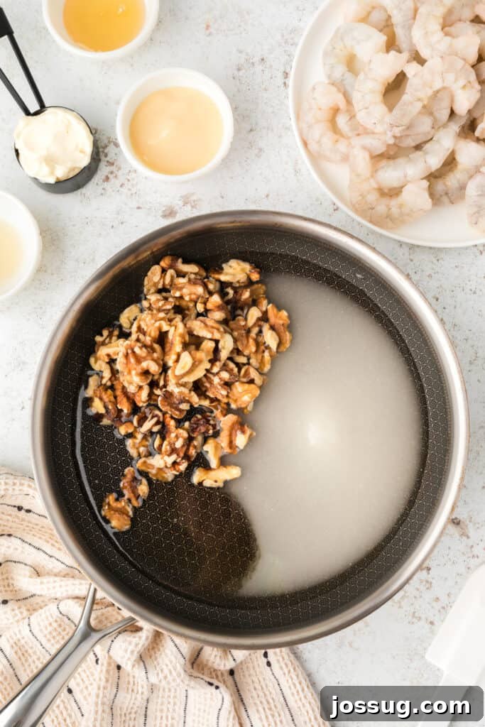 Crispy Honey Walnut Shrimp Recipe: Restaurant-Style at Home 7 Walnuts, sugar, and honey cooking in a skillet for homemade Honey Walnut Shrimp