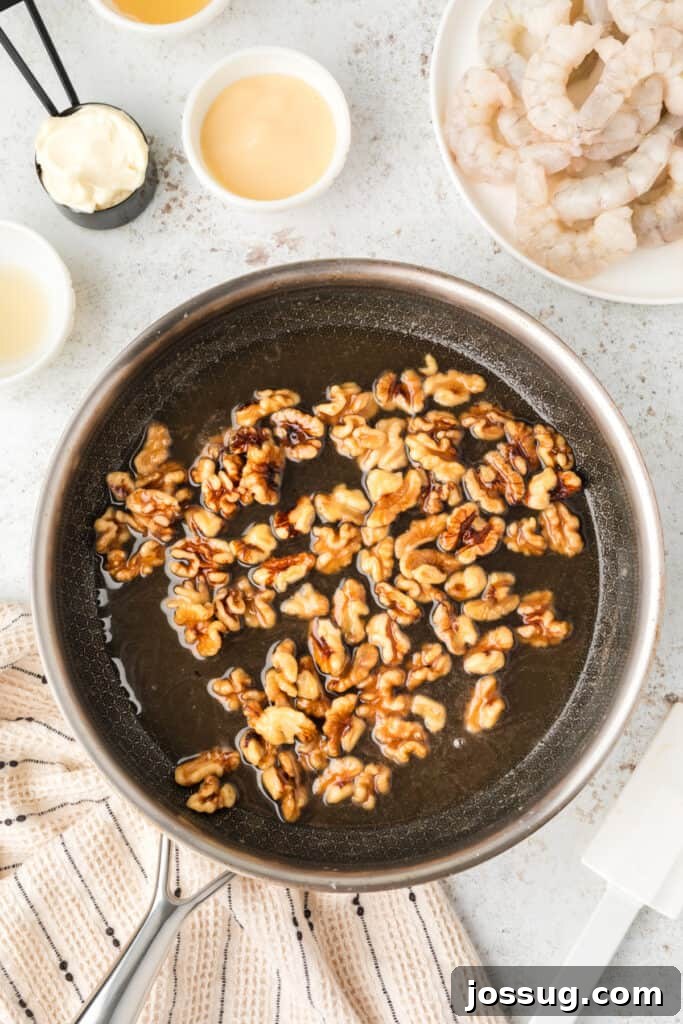 Crispy Honey Walnut Shrimp Recipe: Restaurant-Style at Home 8 Candied walnuts simmering in syrup for Honey Walnut Shrimp recipe