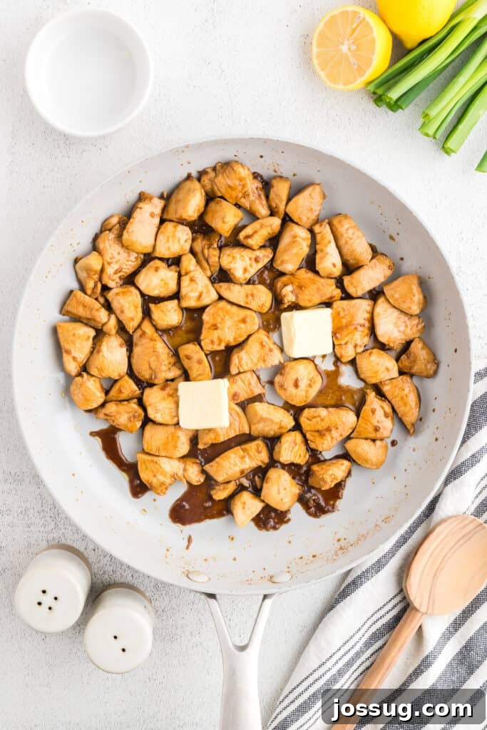 Homemade Hibachi Chicken: Restaurant-Style Recipe You’ll Love 11 Butter added to skillet while finishing homemade Hibachi Chicken with rich Japanese steakhouse flavor.